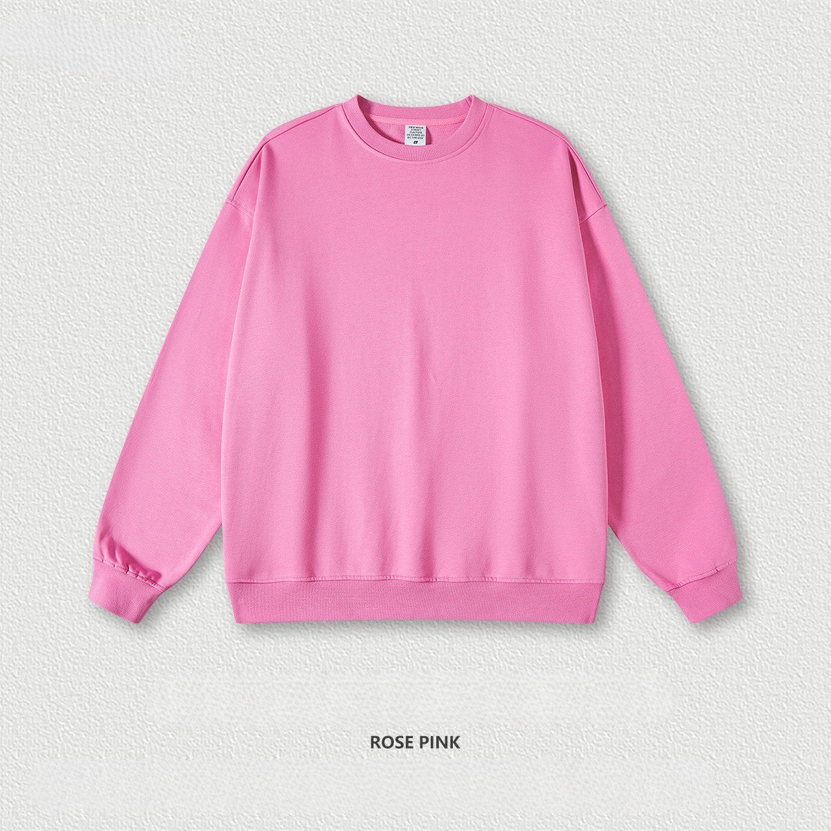 เสื้อฮู้ดคอกลมทรงหลวม ทำจากผ้าขนสัตว์แบบห่วง 440 กรัม สีพื้น มีให้เลือก 11 สี