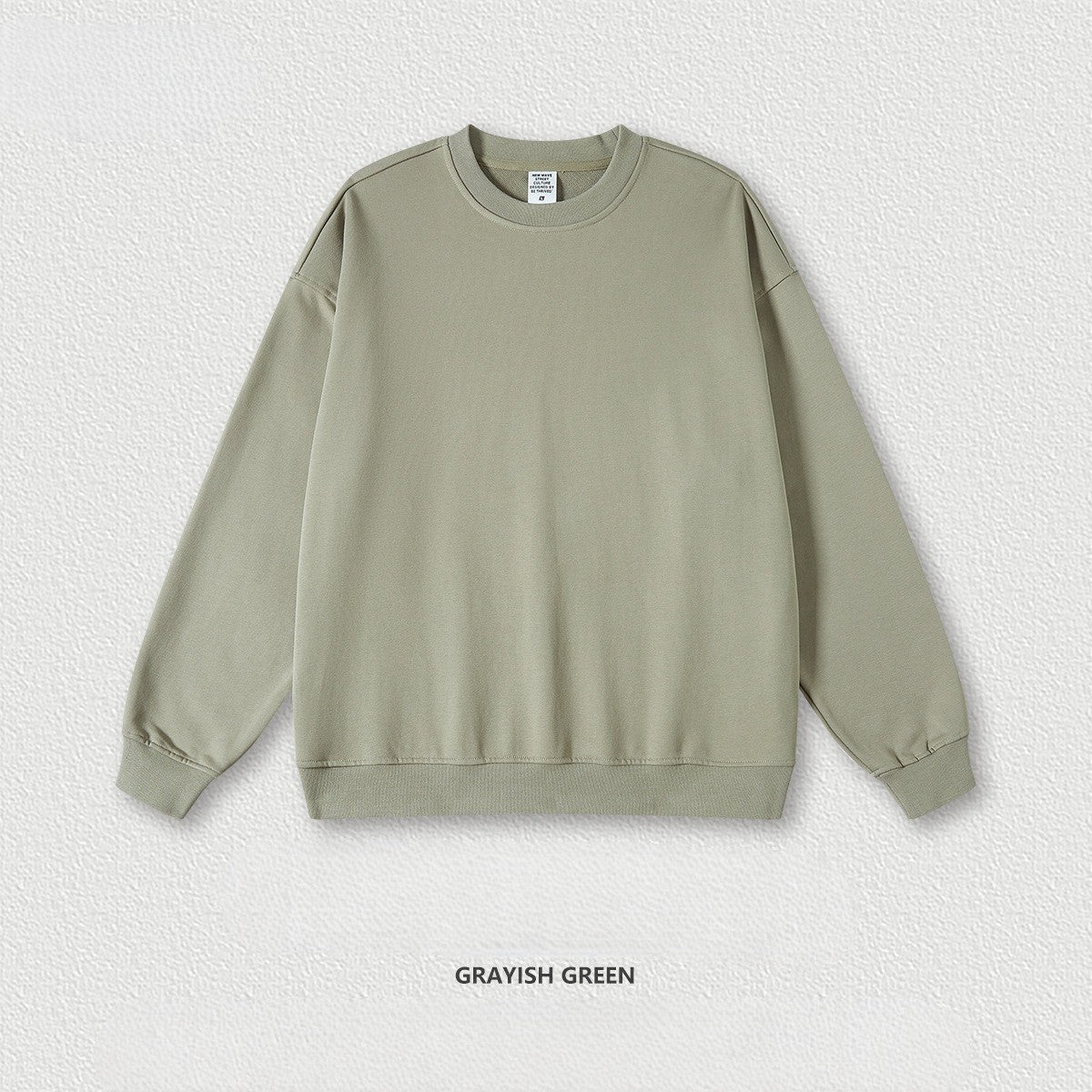 เสื้อฮู้ดคอกลมทรงหลวม ทำจากผ้าขนสัตว์แบบห่วง 440 กรัม สีพื้น มีให้เลือก 11 สี