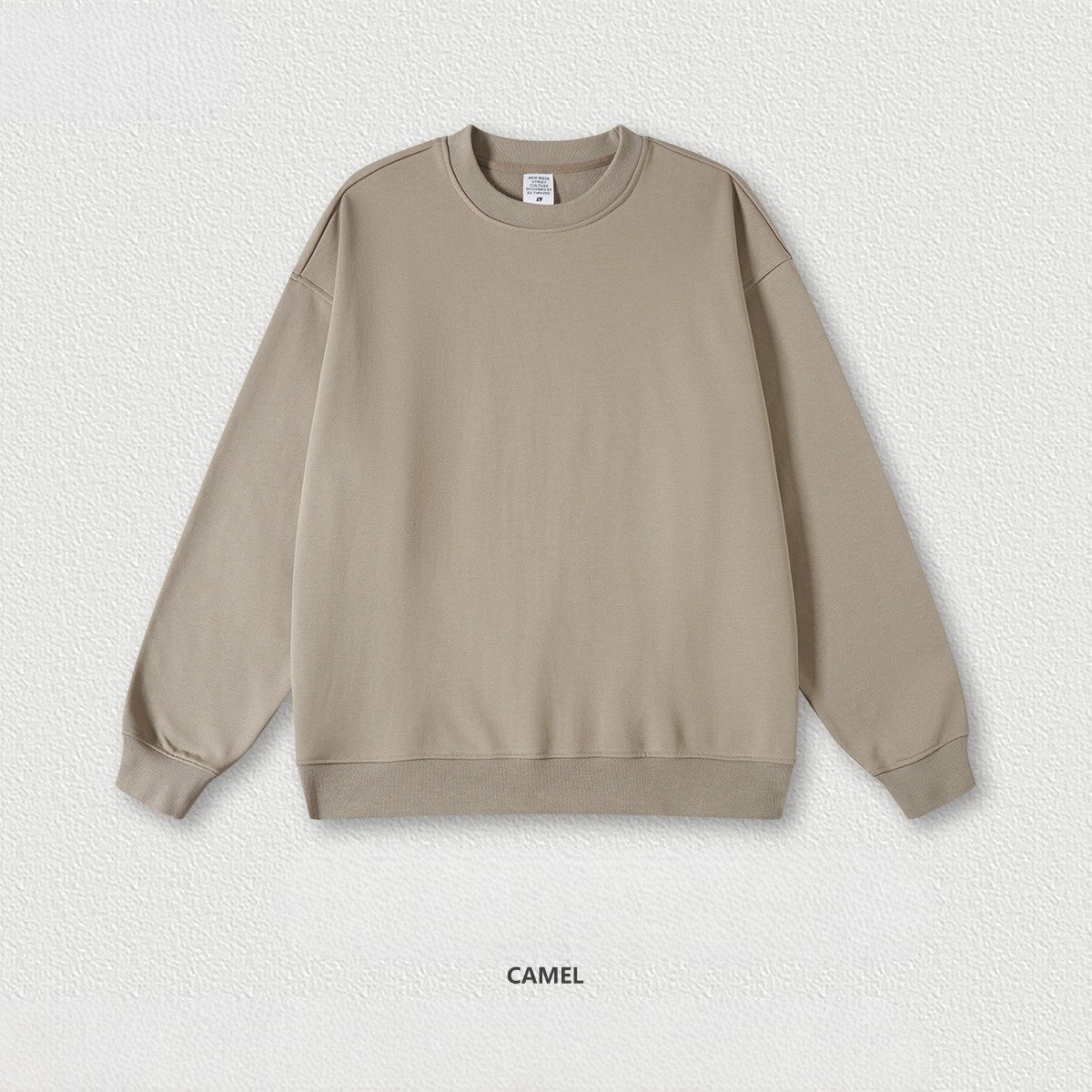 เสื้อฮู้ดคอกลมทรงหลวม ทำจากผ้าขนสัตว์แบบห่วง 440 กรัม สีพื้น มีให้เลือก 11 สี
