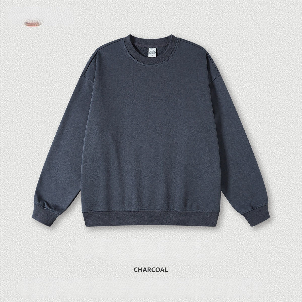 เสื้อฮู้ดคอกลมทรงหลวม ทำจากผ้าขนสัตว์แบบห่วง 440 กรัม สีพื้น มีให้เลือก 11 สี
